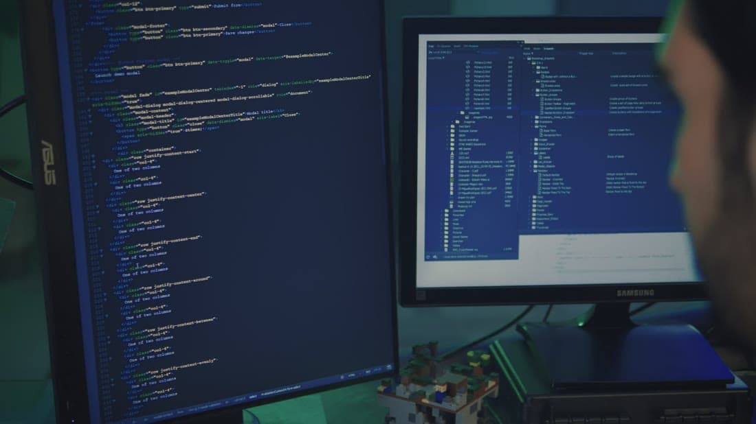Developer building a custom application on a large monitor